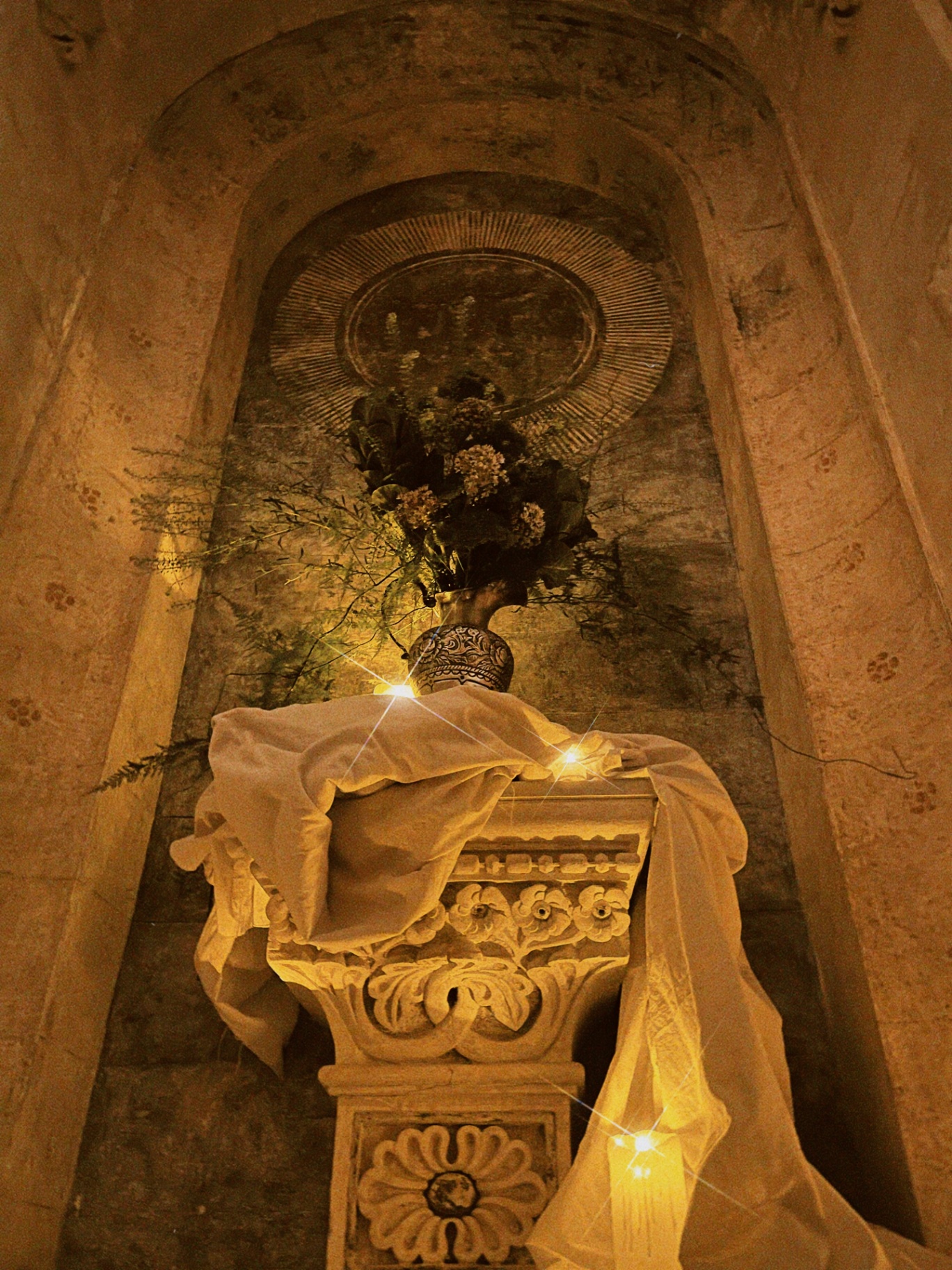 Altar with flowers and candlelight.