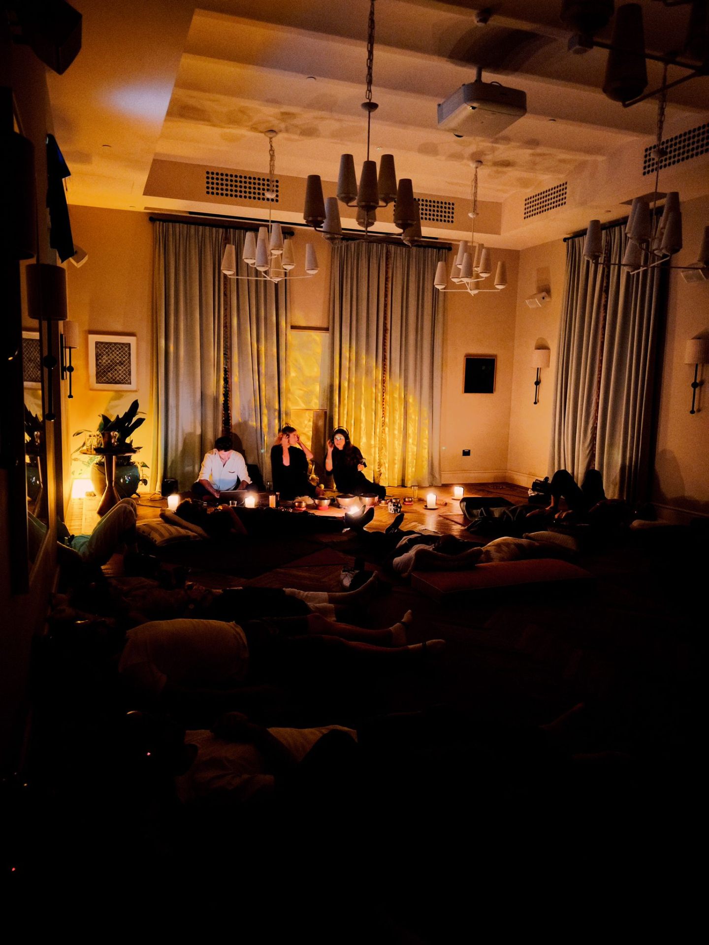 Sound bath in a candlelit room.